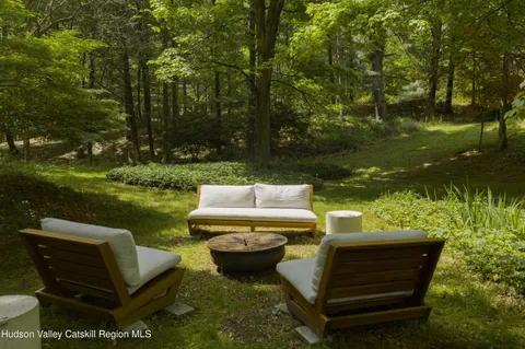a view of a lake with outdoor seating