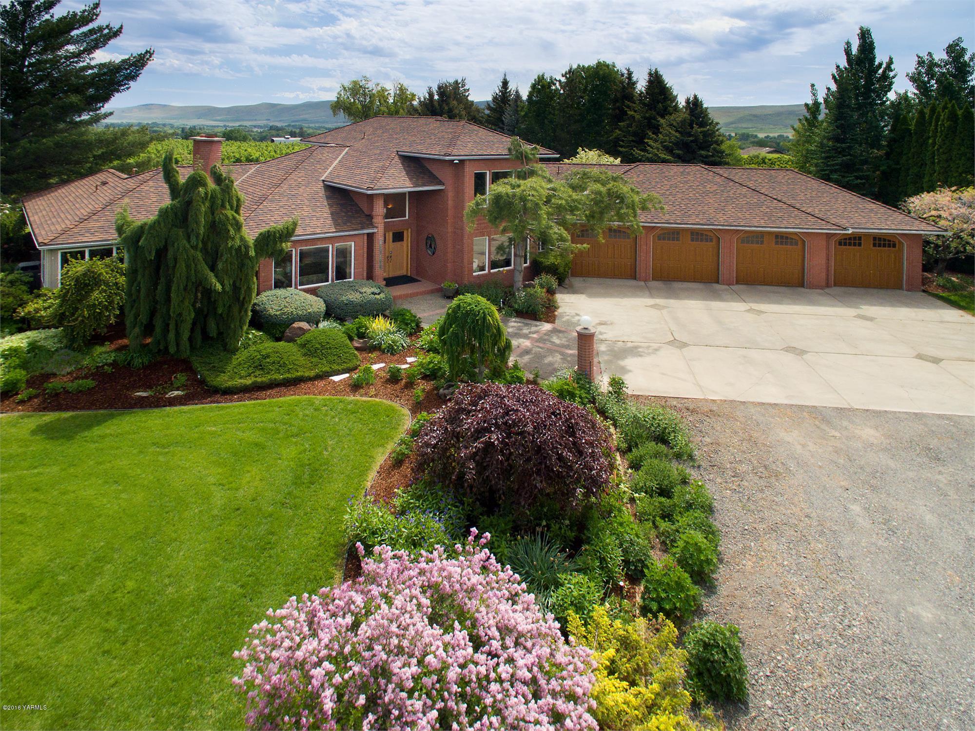 a view of a garden with a house