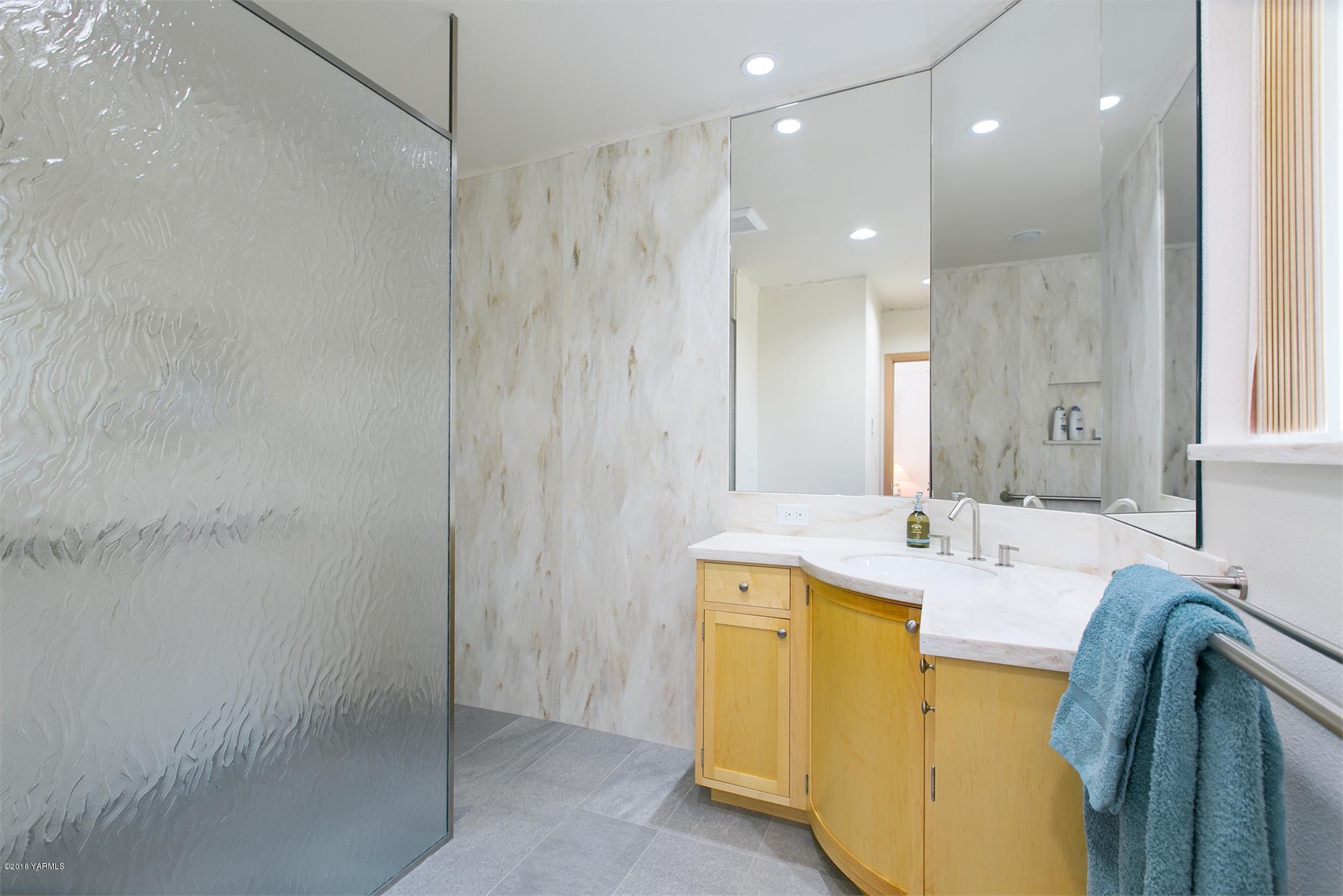 13990 Gilbert Road Yakima, WA 98903 - Photo 17 of 29 a bathroom with a double vanity sink and a mirror