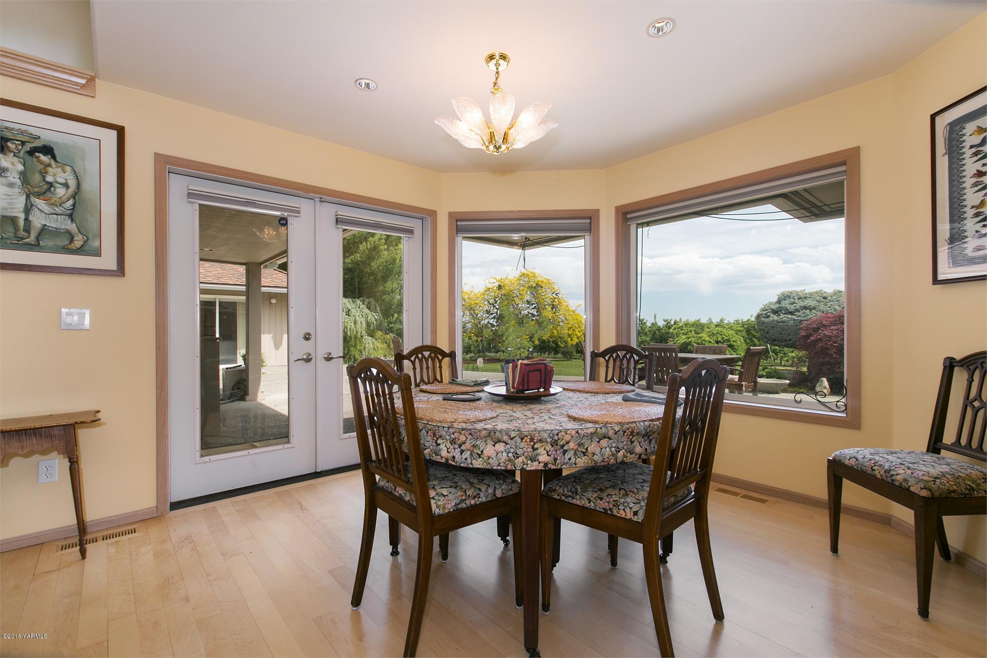 13990 Gilbert Road Yakima, WA 98903 - Photo 10 of 29 a view of a dining room with furniture window and outside view
