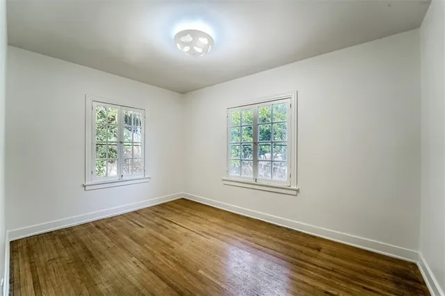 a bathroom with a sink a mirror and a window