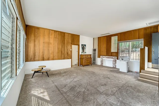 a bathroom with a sink and mirror with toilet