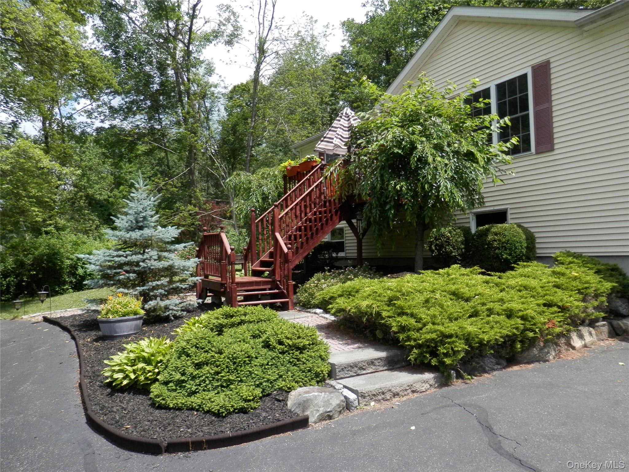 590 Farm To Market Road Brewster, NY 10509 - Photo 4 of 32 a view of a backyard with plants