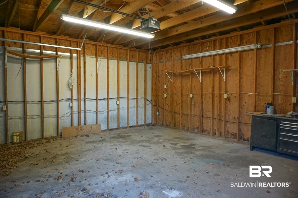 4366 Fathbrook Lane Mobile, AL 36693 - Photo 4 of 14 Garage featuring a garage door opener