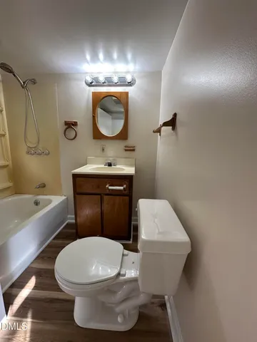 a bathroom with a toilet a sink and bathtub