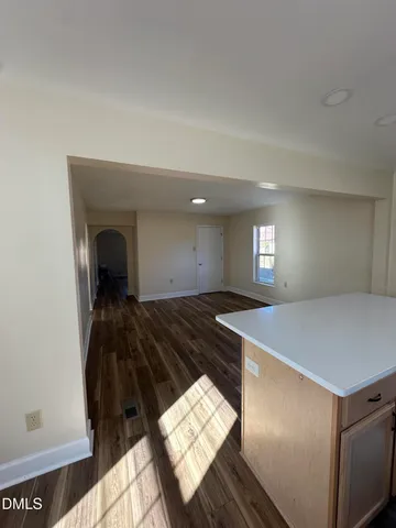 a room with a bed and a chandelier