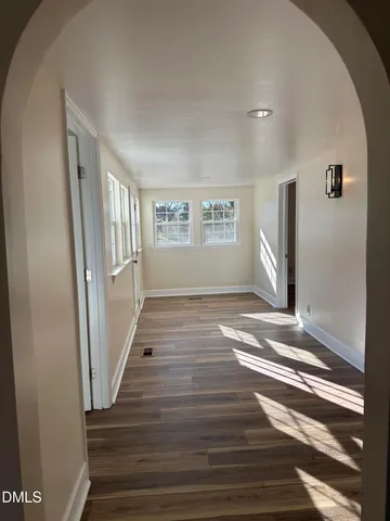 a view of an entryway with wooden floor