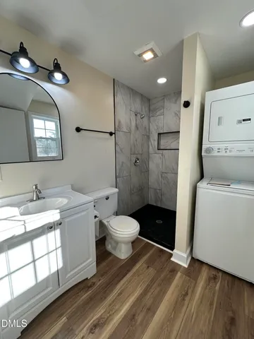 a bathroom with a toilet a sink and a mirror