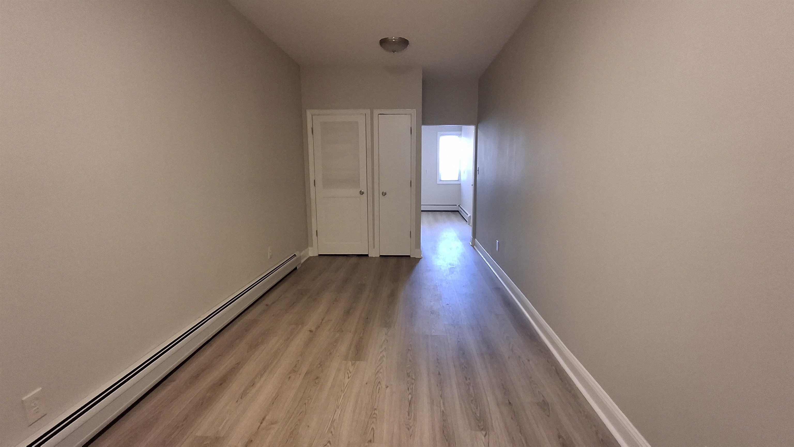 404 Madison Street, Unit 3L Hoboken, NJ 07030 - Photo 5 of 12 a view of a room with wooden floor
