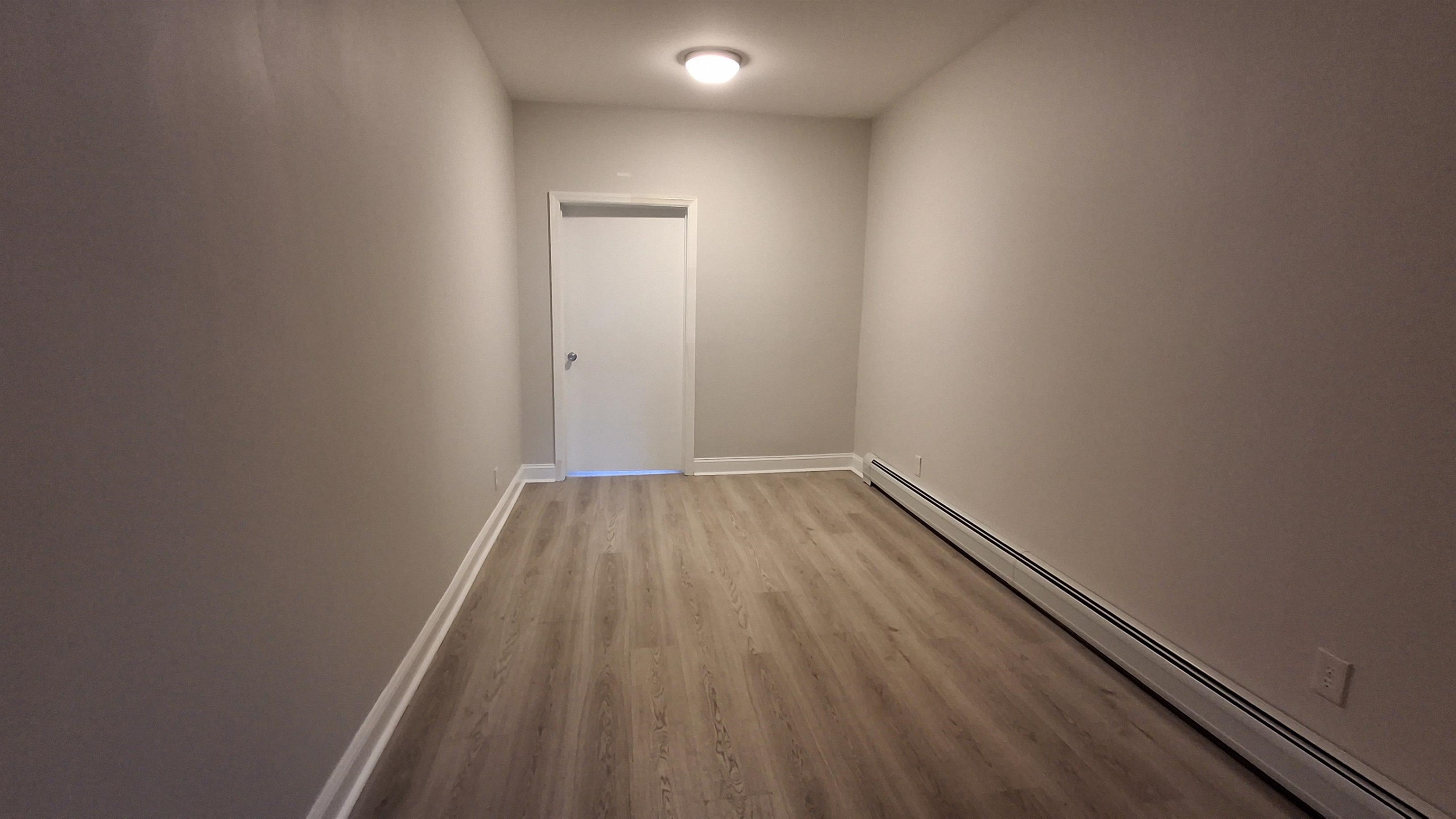 404 Madison Street, Unit 3L Hoboken, NJ 07030 - Photo 6 of 12 a view of a room with wooden floor