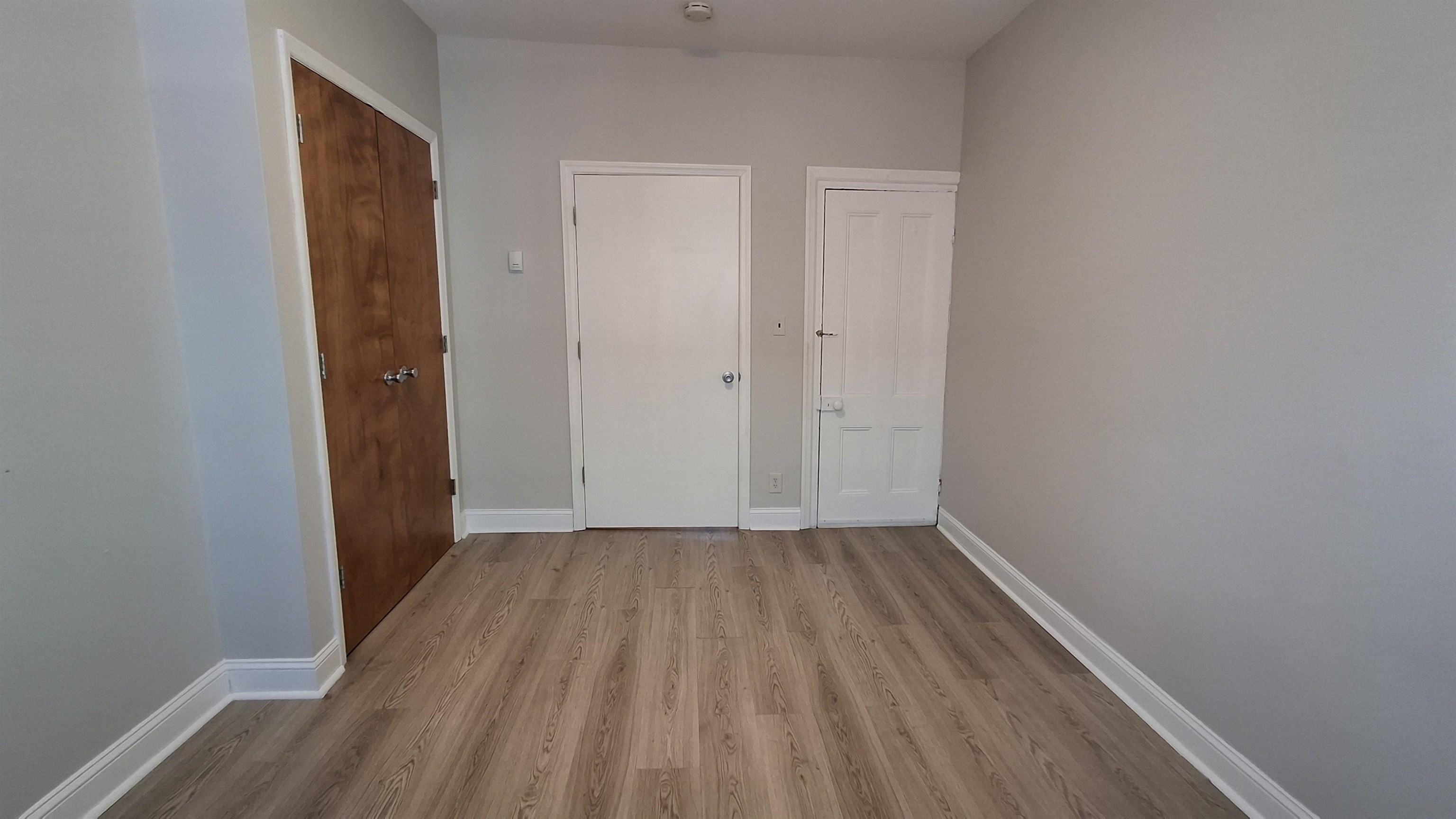 404 Madison Street, Unit 3L Hoboken, NJ 07030 - Photo 7 of 12 a view of a small space with wooden floor and closet
