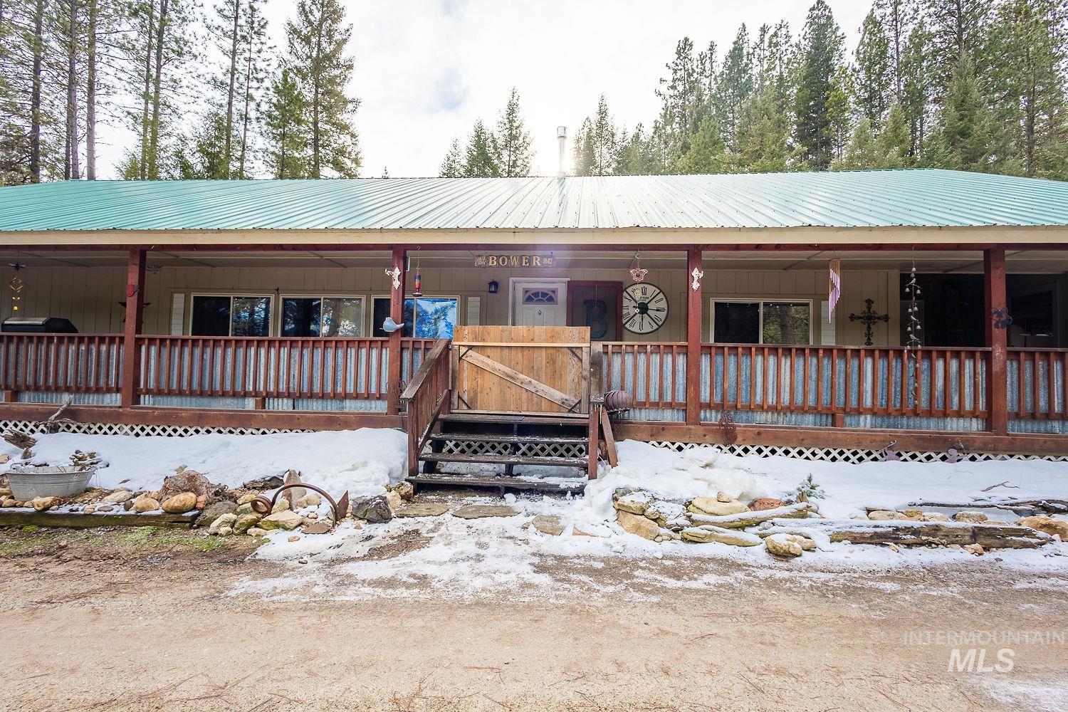 10 Reseda Ridge Circle Garden Valley, ID 83622 - Photo 7 of 28 View of front facade with covered porch and a metal roof