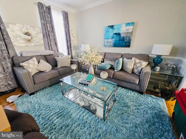 a living room with furniture and a couch