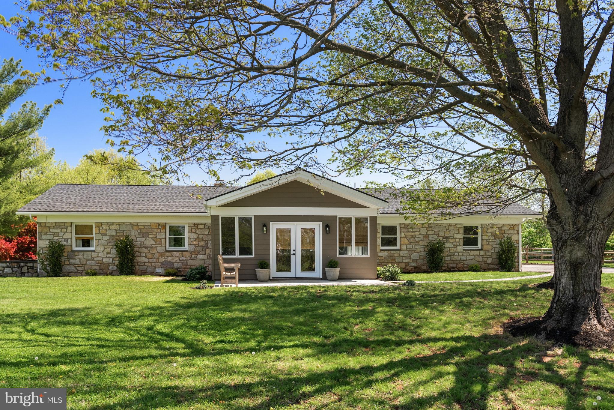 723 Saylors Mill Road Spring City, PA 19475 - Photo 1 of 74 a front view of a house with a garden