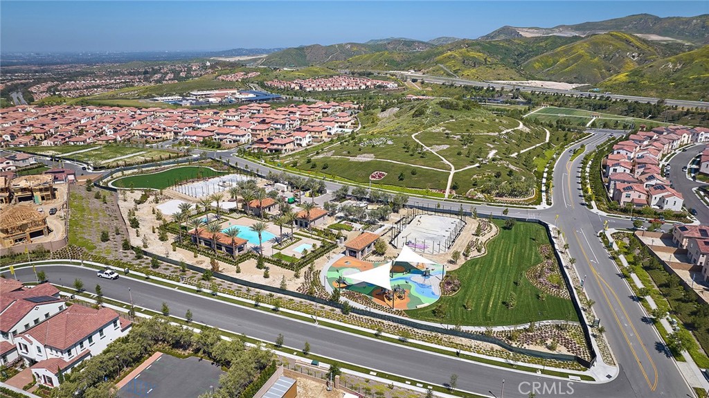 128 Oakstone Irvine, CA 92618 - Photo 4 of 13 an aerial view of residential houses with outdoor space