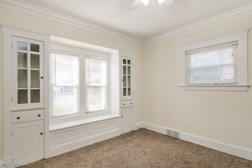 3399 Berkeley Road Cleveland, OH 44118 - Photo 10 of 25 Dining room with built in storage and comfy seat to enjoy the yard.