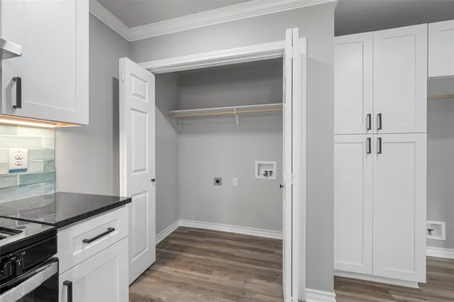 a view of a kitchen cabinets and wooden floor