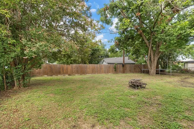 a backyard of a house with lots of green space