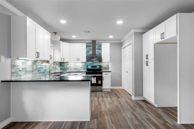 a kitchen with stainless steel appliances granite countertop a refrigerator sink and cabinets