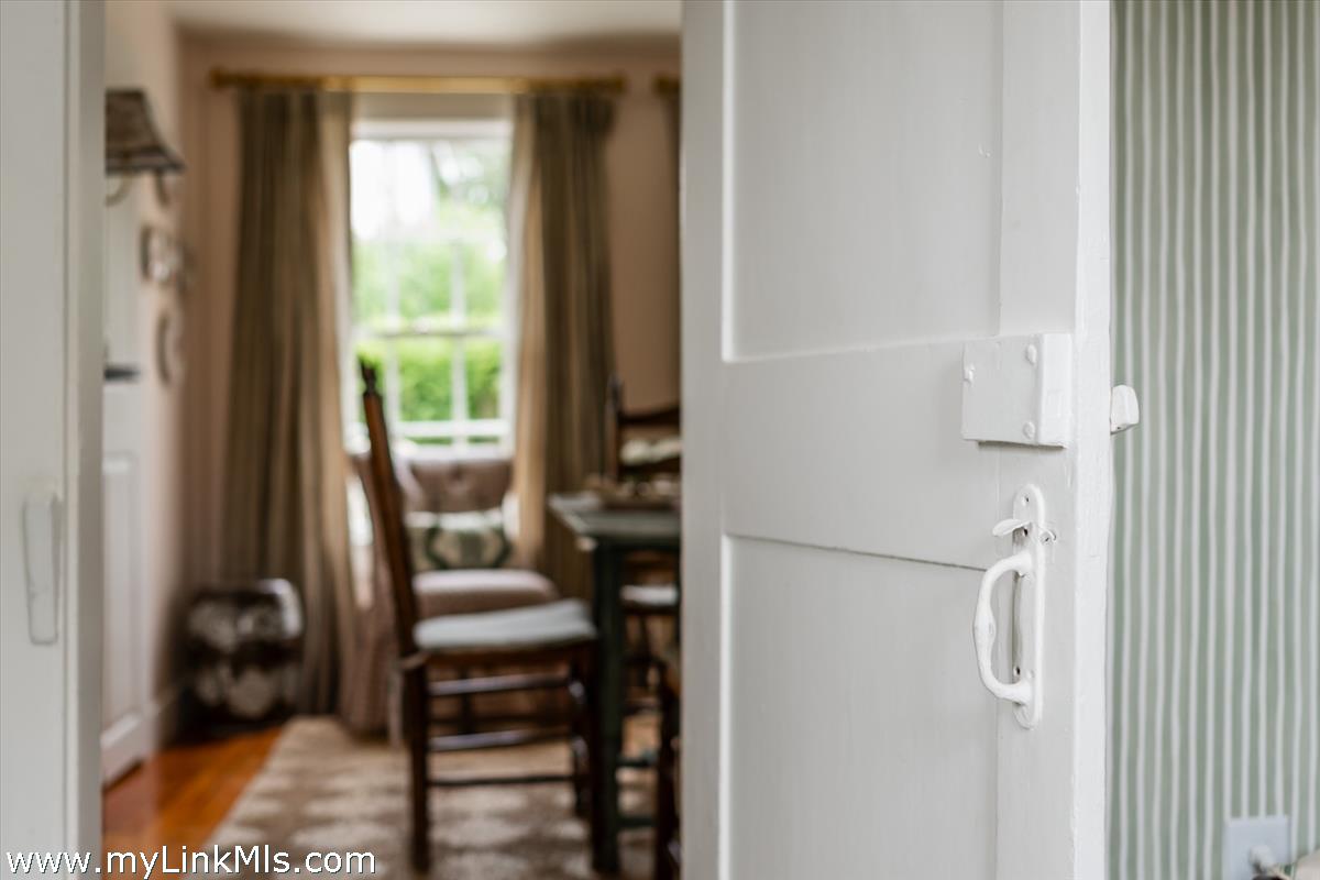 10 Centre Street Nantucket, MA 02554 - Photo 7 of 43 a hallway with chairs and a window