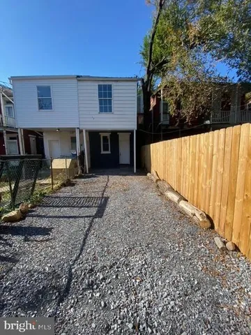 a view of a backyard of the house