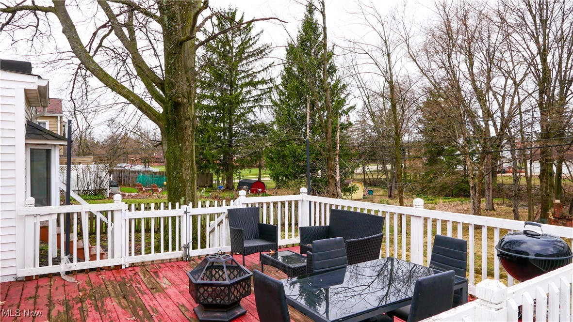 4819 Westbourne Road Cleveland, OH 44124 - Photo 35 of 39 Deck with a grill, a fire pit, and outdoor dining space