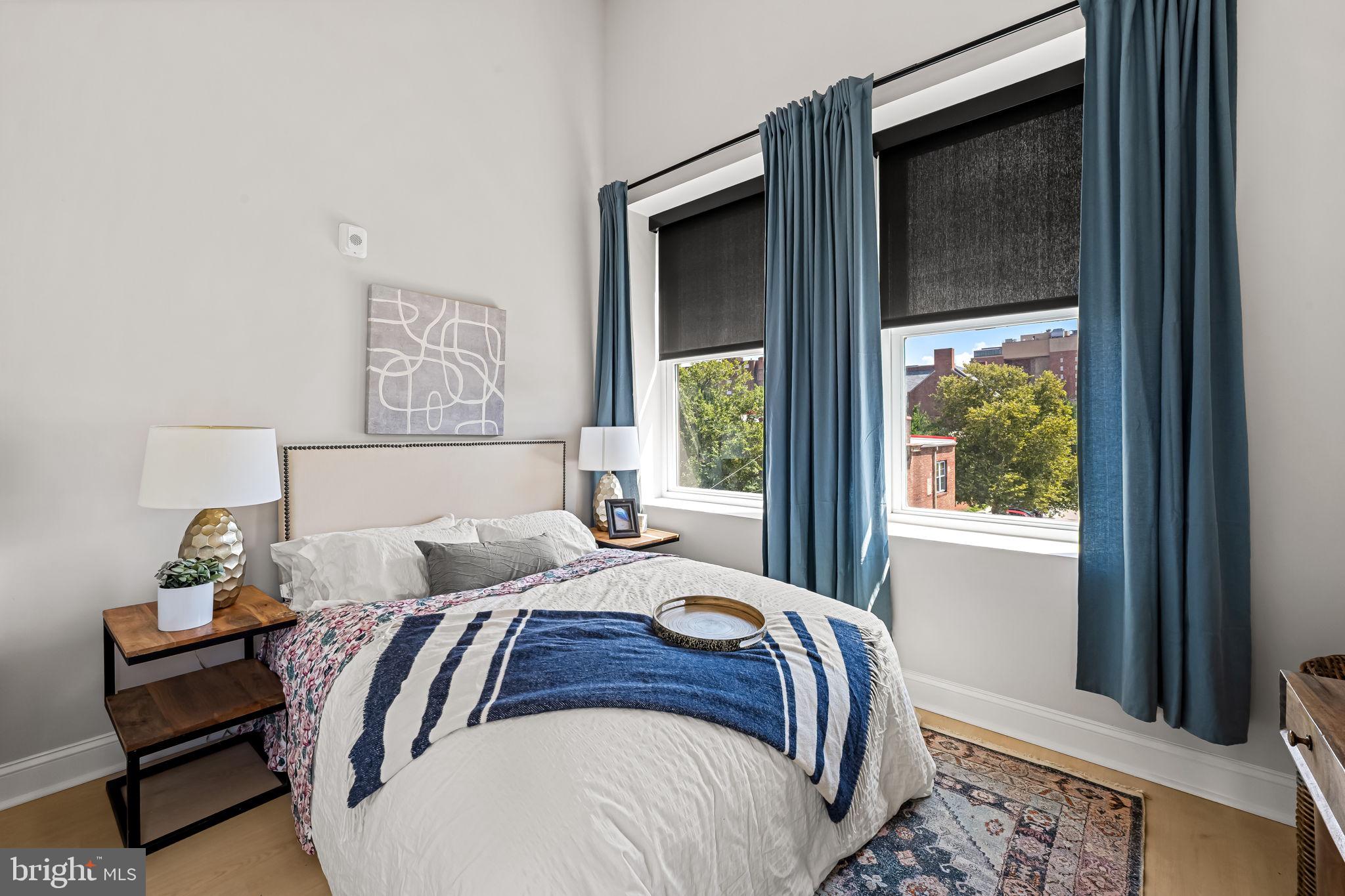 600 North Howard Street, Unit 103 Baltimore, MD 21201 - Photo 14 of 20 a bedroom with bed and a window