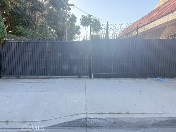 a view of outdoor space with wooden fence