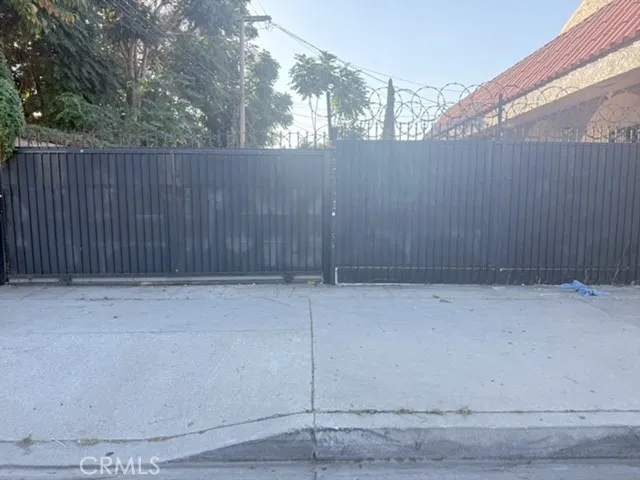 a view of outdoor space with wooden fence