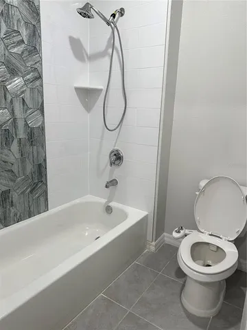 a bathroom with a toilet a sink and a bathtub