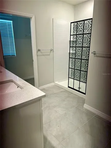 a view of kitchen with cabinets