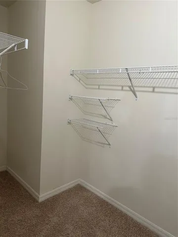 a view of a room with racks on the wall