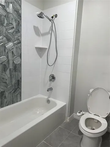 a bathroom with a toilet and a sink