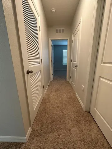 an entryway with a hallway