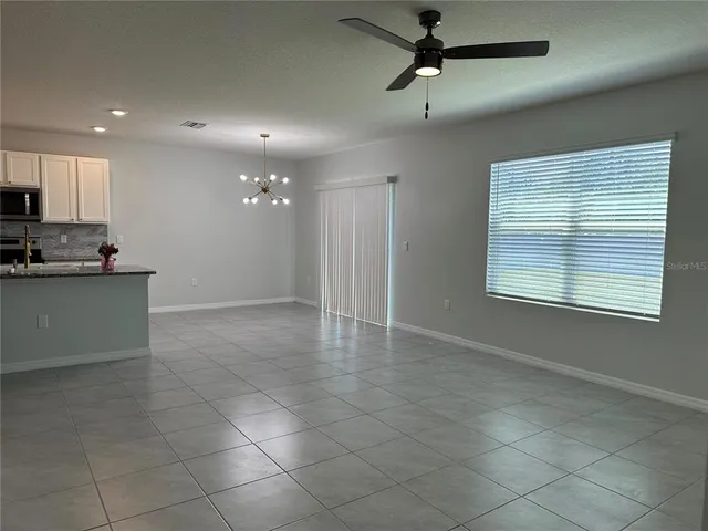 a view of a kitchen with a stove and a window