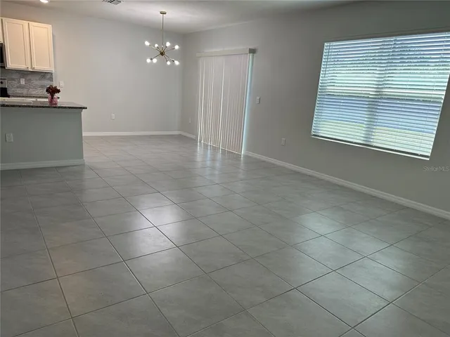 a view of a kitchen with a sink and a window