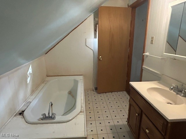 7987 Ridge Road North Royalton, OH 44133 - Photo 26 of 45 Full bathroom featuring a tub, vanity, light flooring, and lofted ceiling