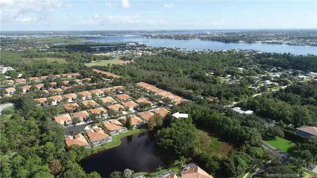 an aerial view of residential building with green space