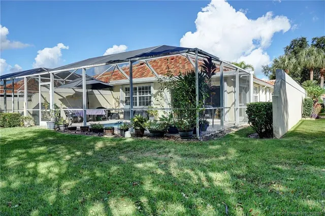 a living room filled with furniture and a flat screen tv