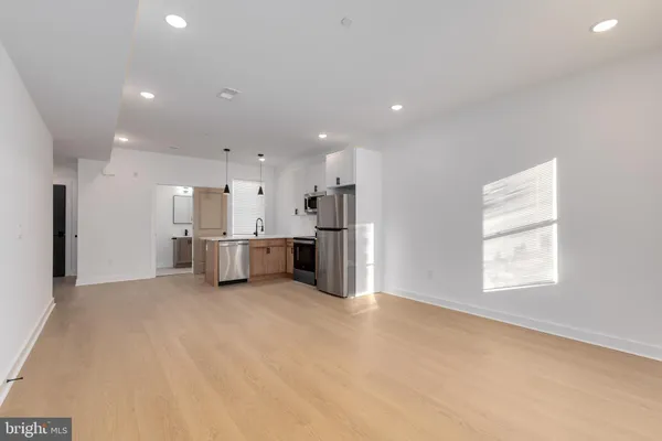 a view of a kitchen with a sink