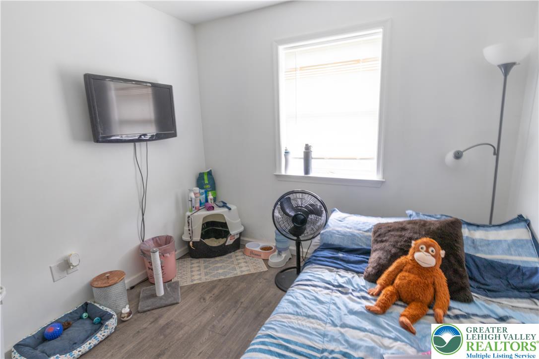 257 Ridgeview Drive Alburtis, PA 18011 - Photo 14 of 24 Bedroom #2 features ample window light and durable vinyl flooring, creating a comfortable living space.