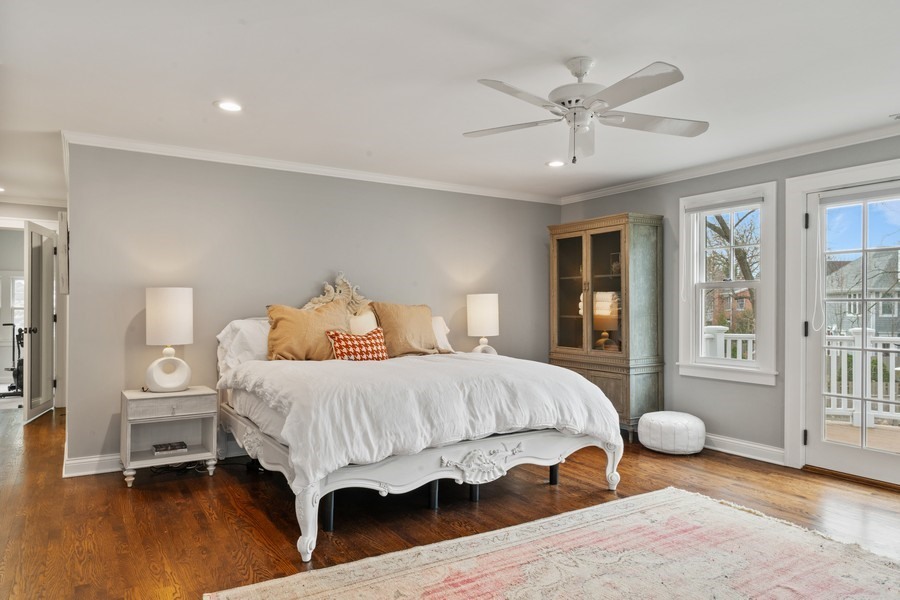 346 Sheridan Road Winnetka, IL 60093 - Photo 27 of 59 a bedroom with a bed and wooden floor