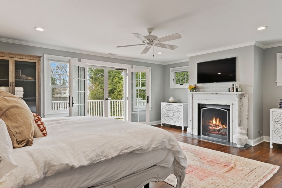 346 Sheridan Road Winnetka, IL 60093 - Photo 28 of 59 a bedroom with a large bed and a flat screen tv