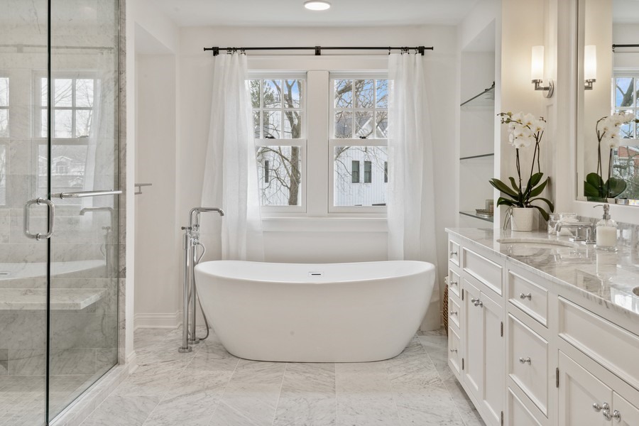 346 Sheridan Road Winnetka, IL 60093 - Photo 29 of 59 a spacious bathroom with a bathtub and shower