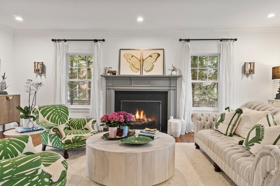 346 Sheridan Road Winnetka, IL 60093 - Photo 3 of 59 a living room with furniture potted plant and a fireplace