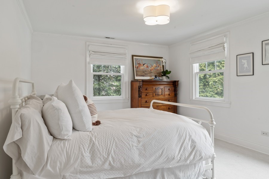 346 Sheridan Road Winnetka, IL 60093 - Photo 34 of 59 a bedroom with a bed and a window