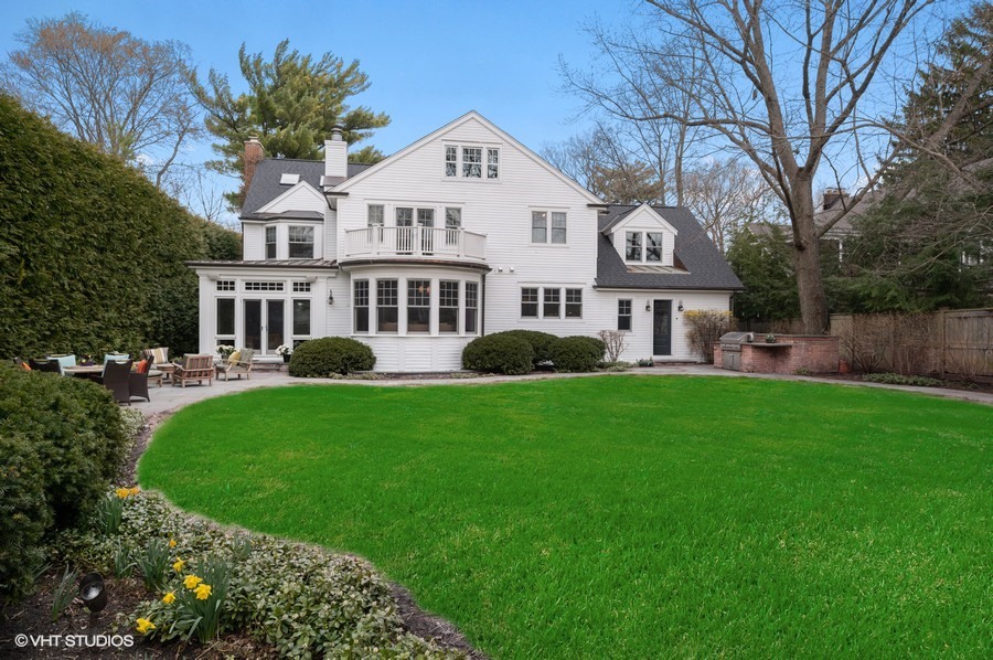 346 Sheridan Road Winnetka, IL 60093 - Photo 48 of 59 a front view of a house with a garden and trees