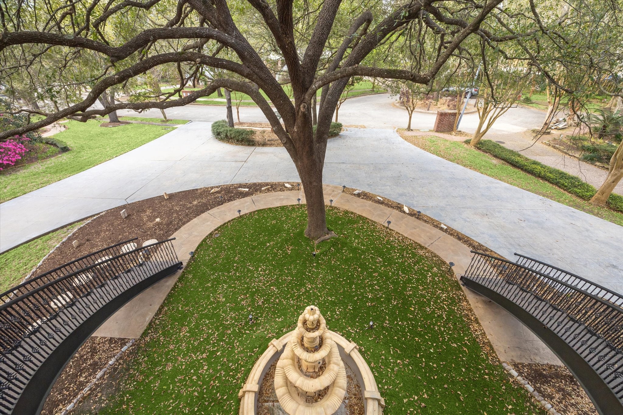 1406 Spring Cress Lane Seabrook, TX 77586 - Photo 5 of 50 The front lawn and circle driveway, as viewed from the front entry at the top of the dual stairs. The lot is located on a cul-de-sac.