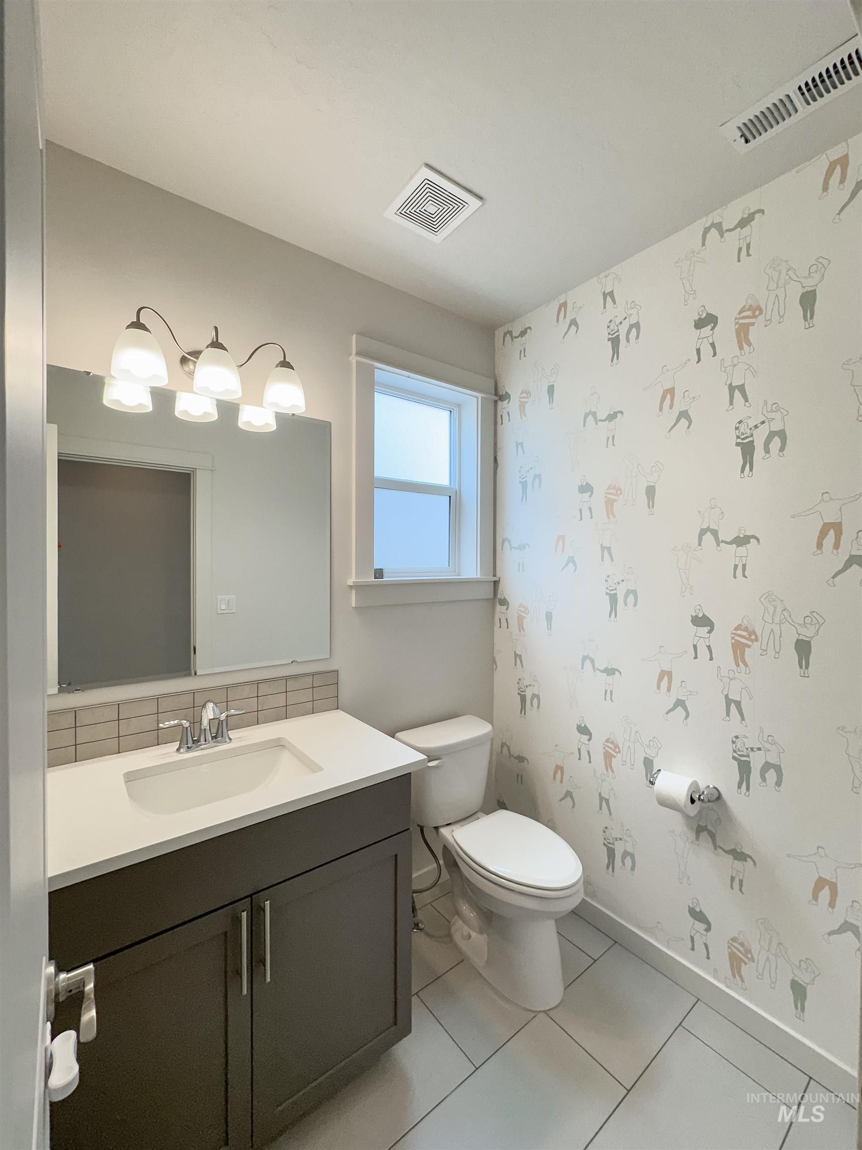 9687 West Arnold Road Boise, ID 83714 - Photo 15 of 37 Modern vanity with an integrated rectangular sink and polished chrome faucet