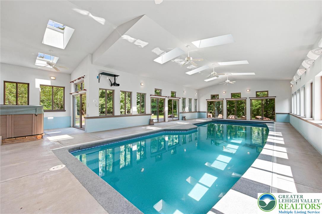 475 Crowthers Road Quakertown, PA 18951 - Photo 4 of 93 An indoor pool with multiple skylights and windows offers a bright, year-round aquatic escape.